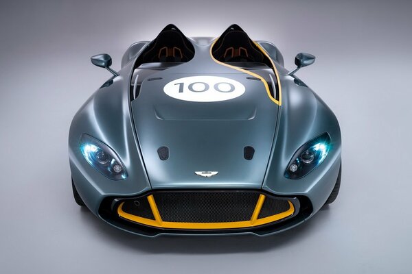 Aston martin cc100 pictured in profile on a grey background