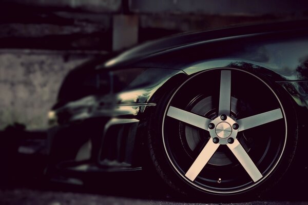 Black BMW on a black and white background