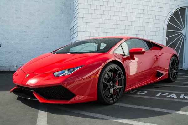 Red lamborghini waiting for the owner