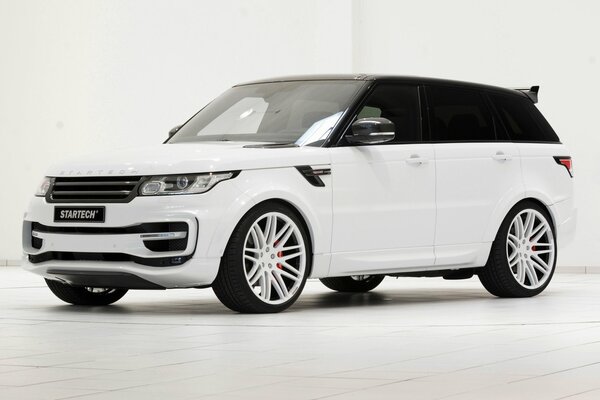 Sport utility vehicle in a white room