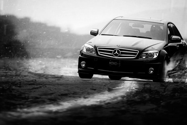 Mercedes on a washed-out road in a skid