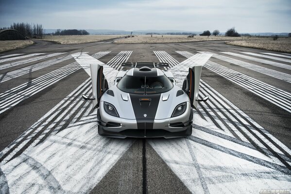 Silver koenigsegg on the runway