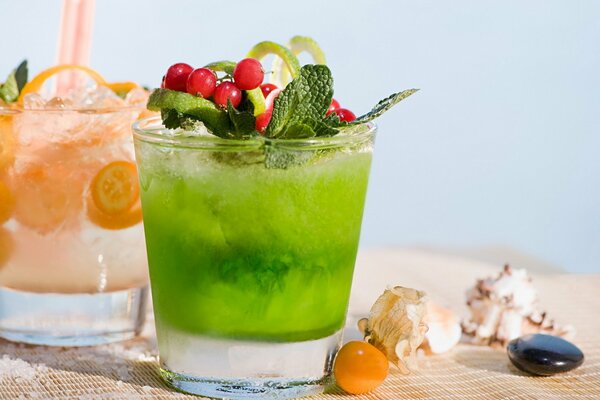 Two refreshing berry drinks on the beach