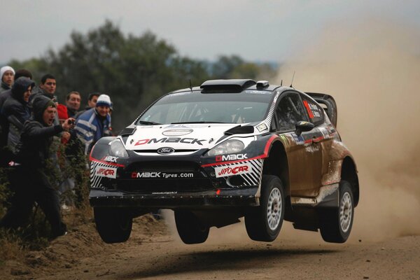 Ford fiesta on the highway in the dust