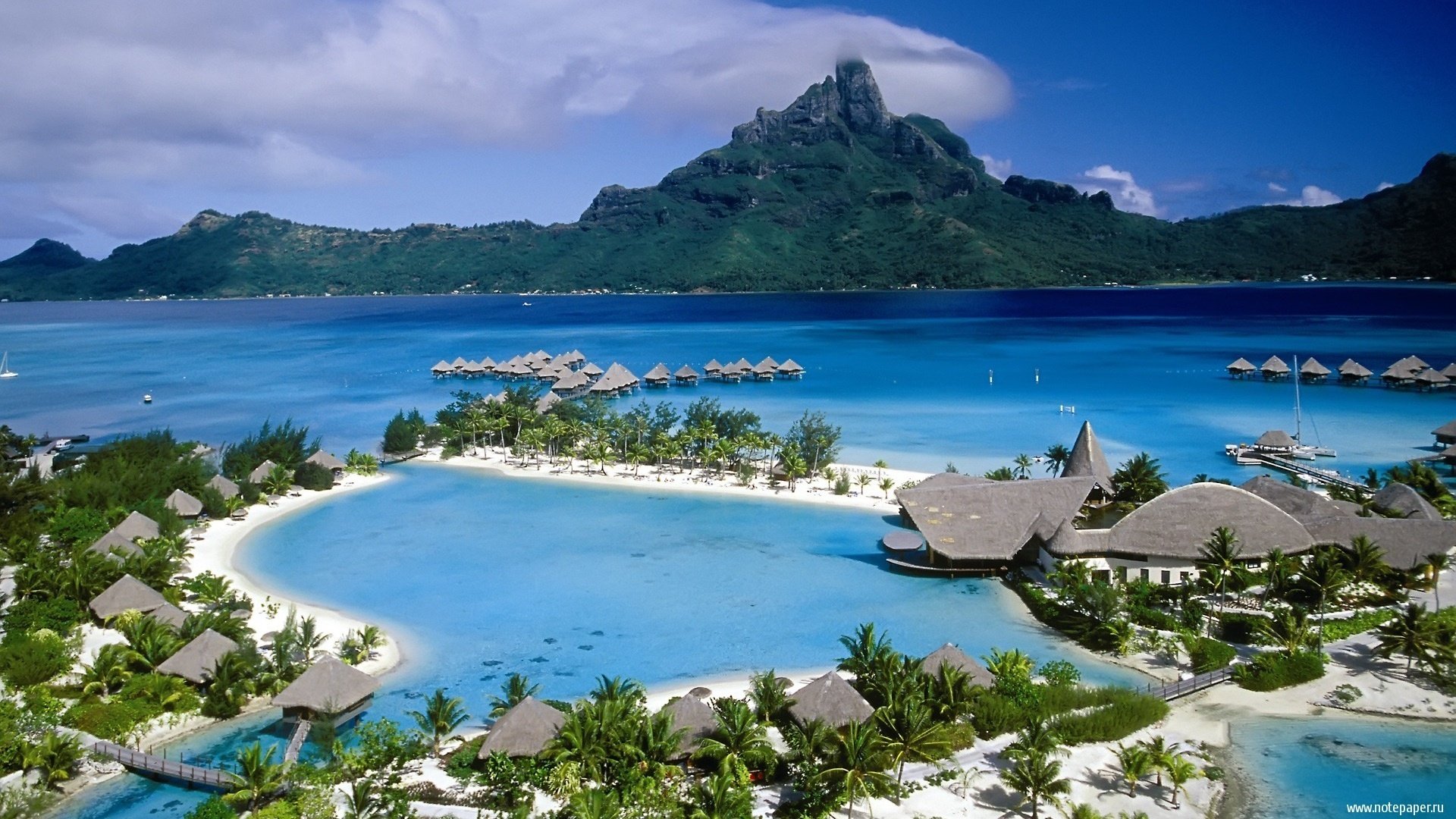 islands sand palm trees laguna the ocean mountains home resort trees the sky clouds paradise beach