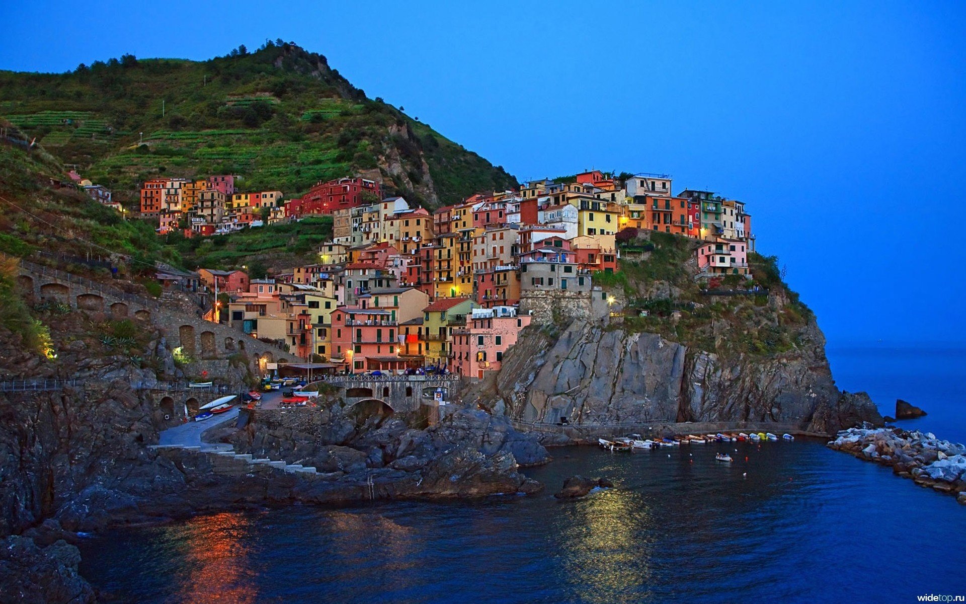 italy the city sea colorful houses mountain rocks the sky trees water shore