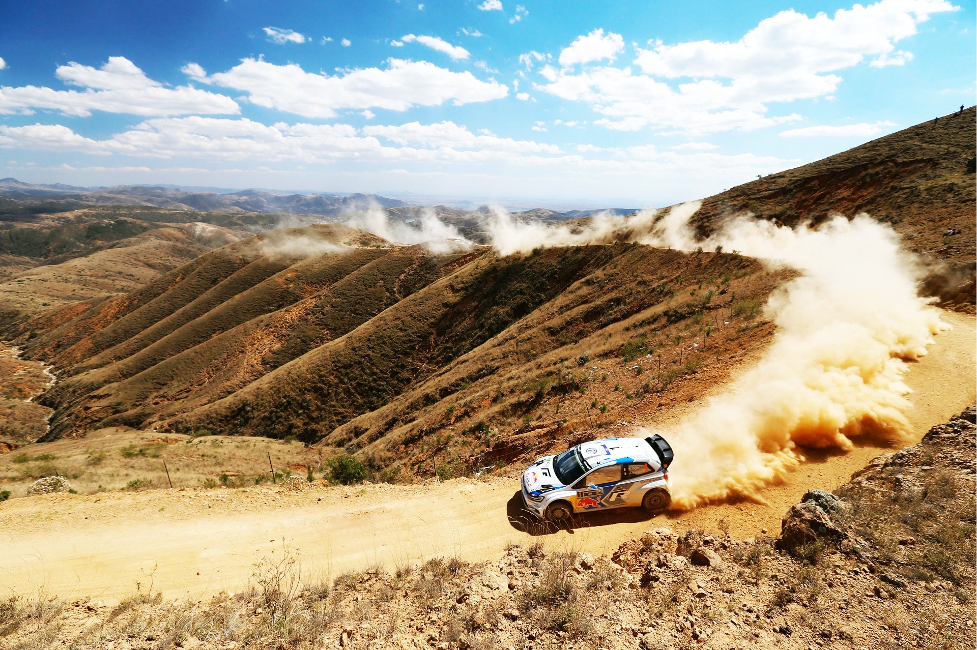 volkswagen polo wrc rally car speed rotation dust hill day sky white