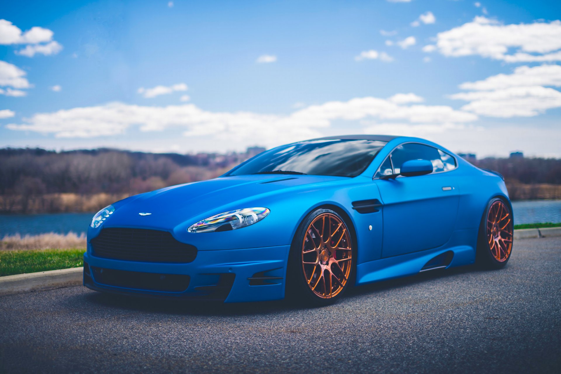 aston martin vantage v12 azul deporte coche stancenation carretera frente