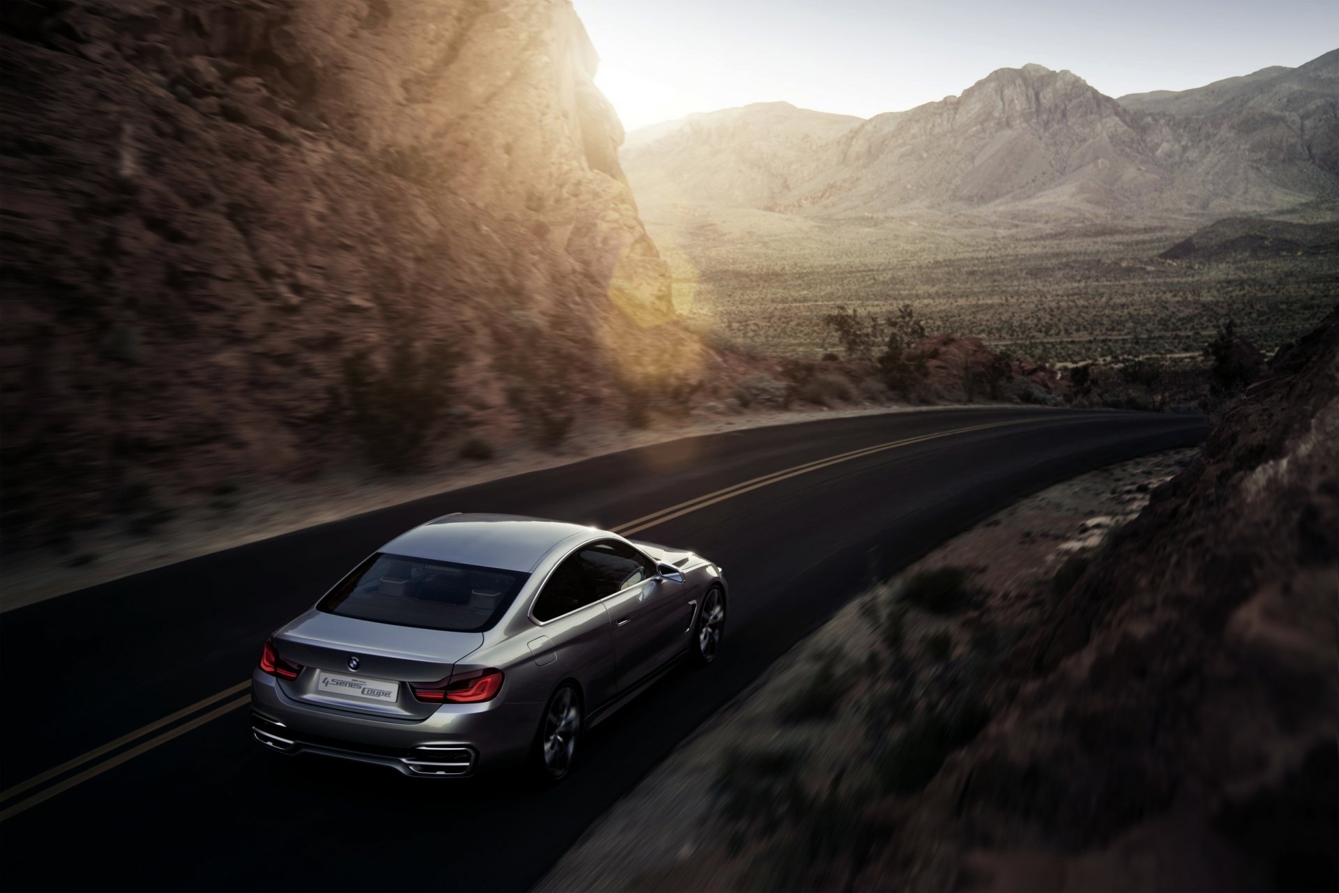 bmw serie 4 coupé concetto argento strada tramonto montagna