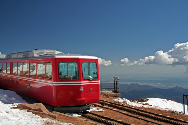 Train on the railway on the background of a mountain landscape