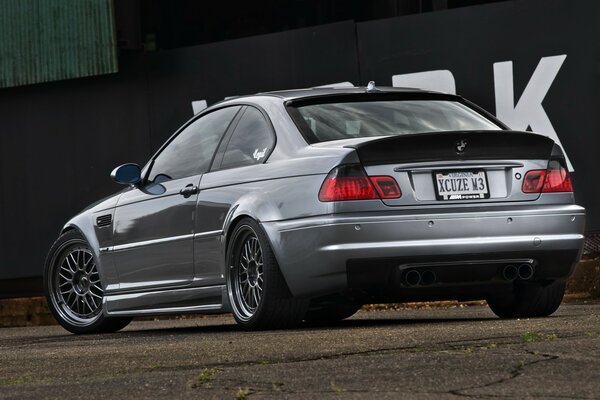 Silver car on the race track