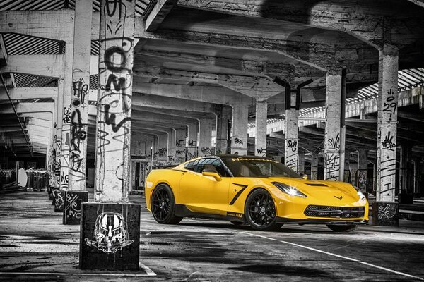 Yellow chevrolet corvette shows off its muscles