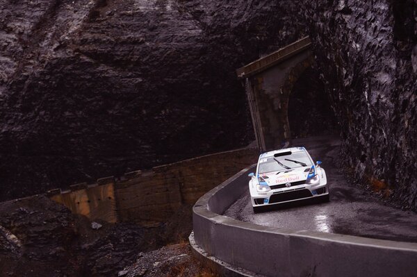 A volkswagen car drives along the road