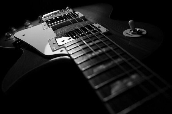 Beautiful angle photo of a guitar on a dark background