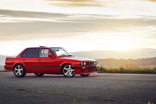 BMW m3 car on the background of sunset