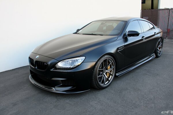 Bmw grand coupe in the courtyard of the house