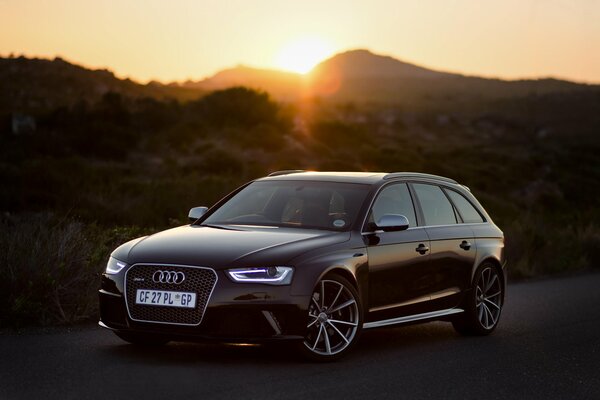 Black Audi rs4 on sunset background