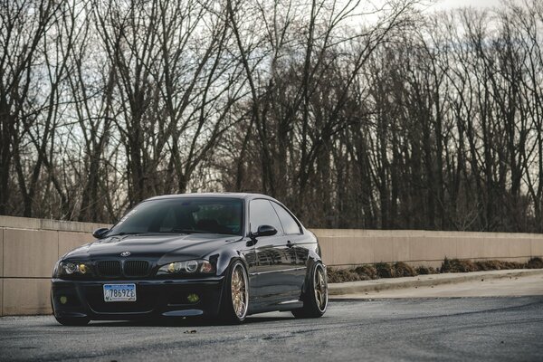 Tuned black bmw m3 e46 car on the road