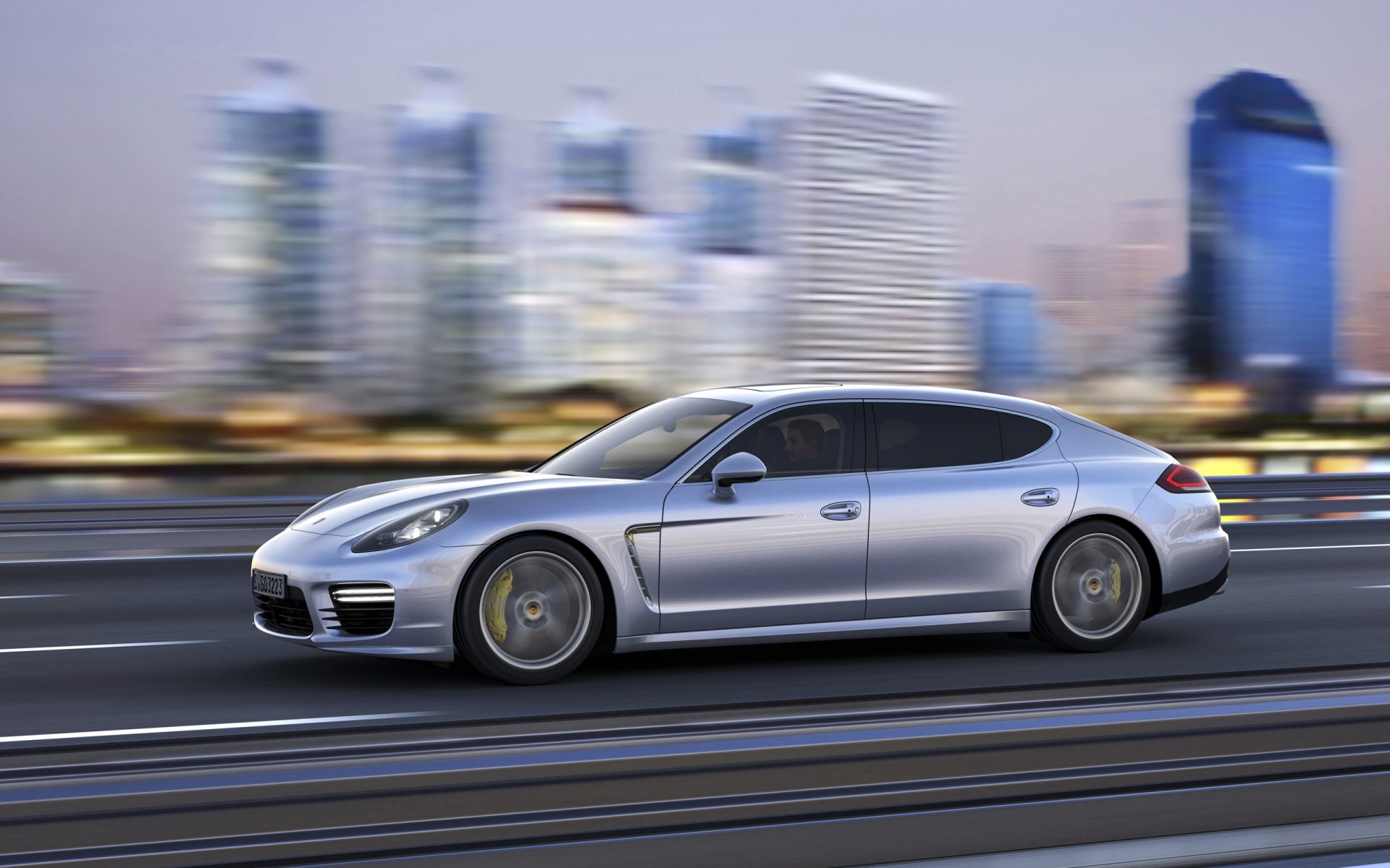 porsche panamera auto samochód szary w ruchu widok z boku miasto sedan