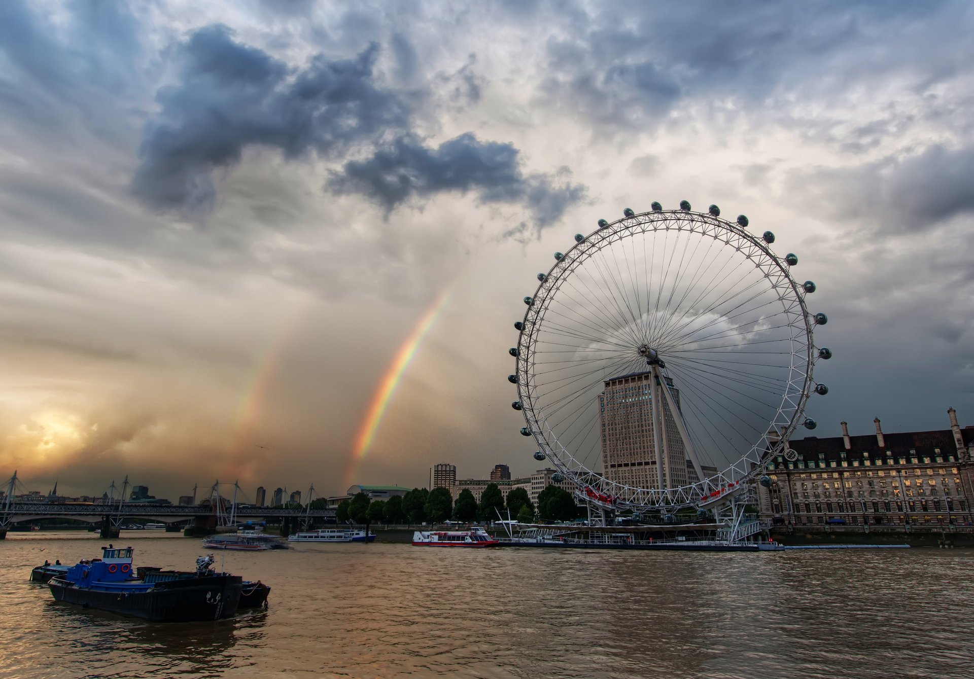 london-ay rainbow thames london carousel england boats overcast clouds bridge river home the sky city