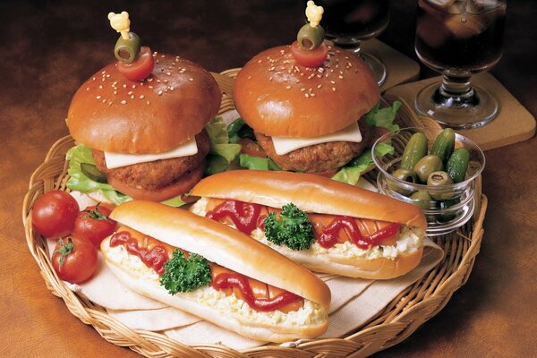 Hamburgers and hot dogs with vegetables on a platter