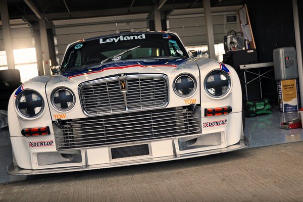 A racing car with a steep front and headlights