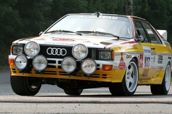 Sports yellow Audi car at the rally