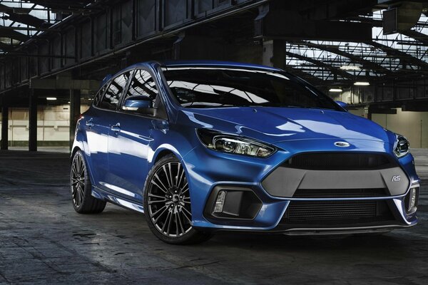 Blue Ford focus in an urban structure