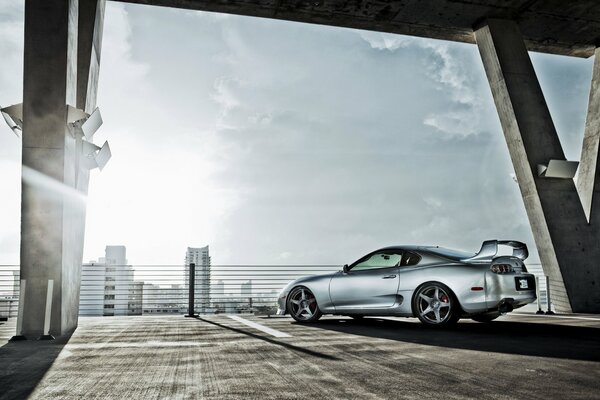 Silver Toyota Supra in the parking lot