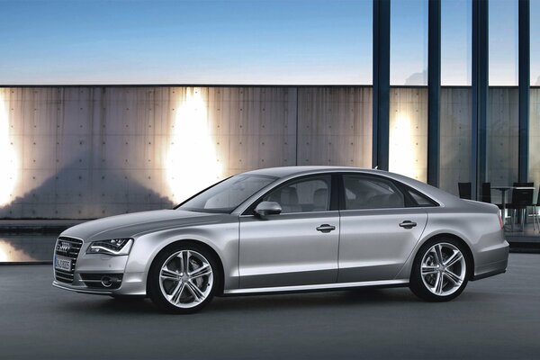 The unforgettable and bright grey audi s8 is located sideways