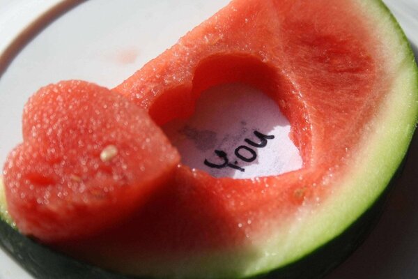 Red watermelon with a carved heart