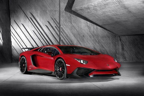 A tuned red Lamborghini in the garage