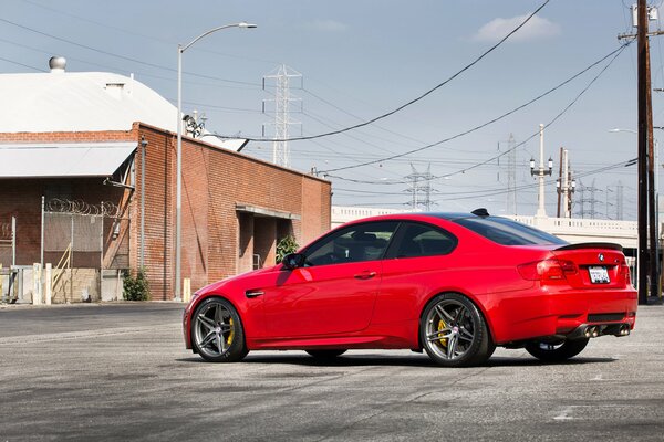 BMW red car on the road background