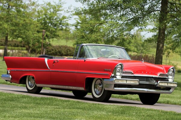 A 1957 red Lincoln convertible