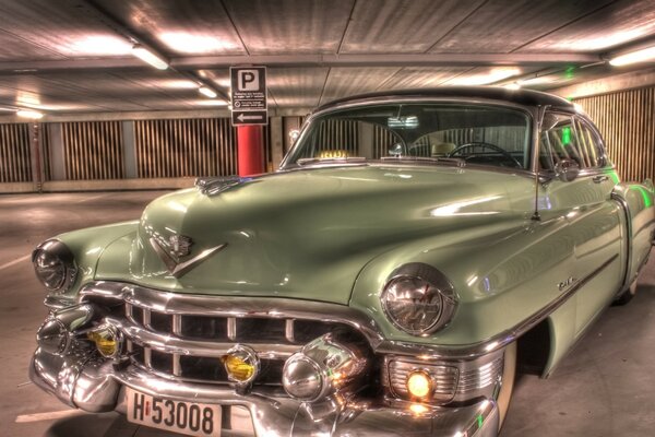 Vintage khaki car in the parking lot