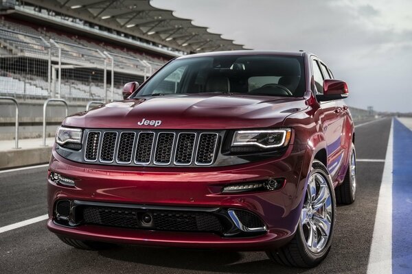 Red Jeep Cherokee at the stadium