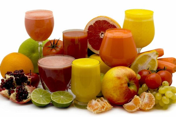 Freshly squeezed juices on a background of fruit