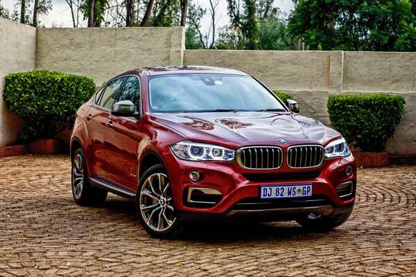 Red bmw x6 2015. Front view