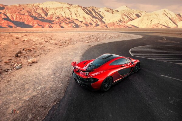 Sporty red Ferrari McLaren hypercar on the race track