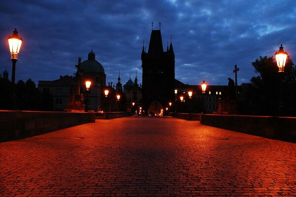 Cobblestone bridge surrounded by lanterns at the fortress