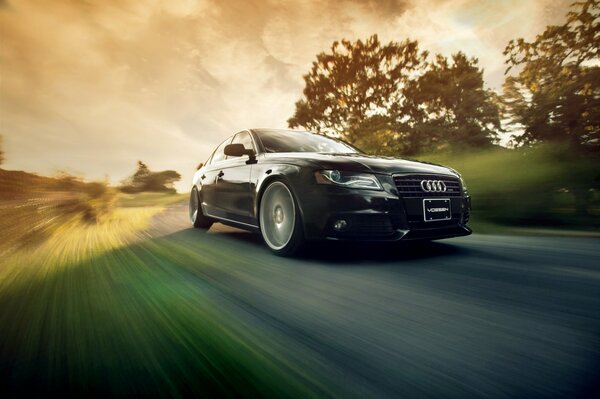 Black Audi overcomes kilometers at speed