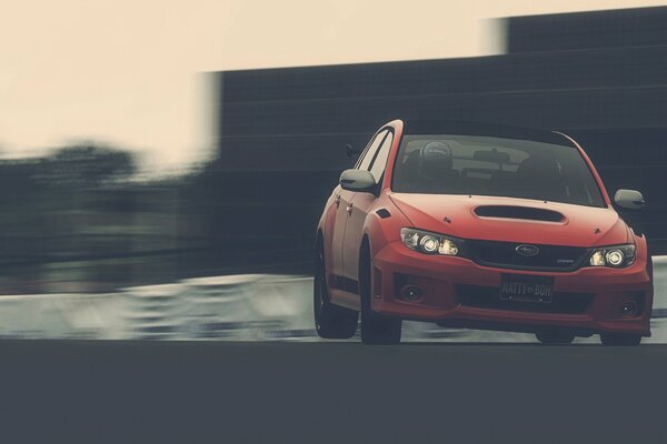 Subaru car on the highway at speed with a racer pilot