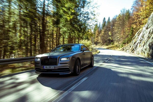 Rolls royce rides on a mountain road