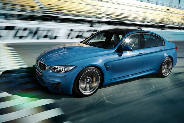 Luxury blue BMW driving on the highway