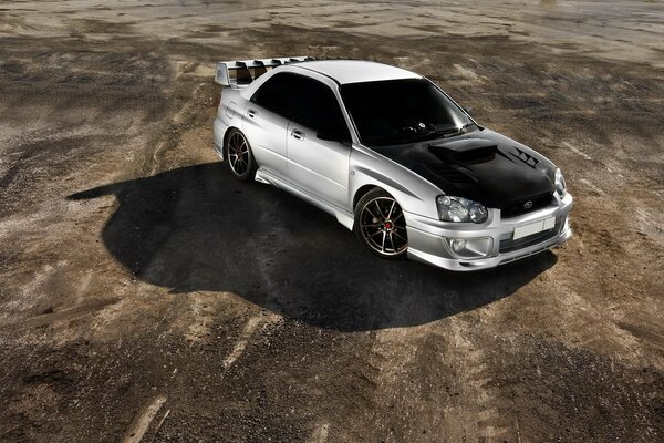 Silver subaru car on the road