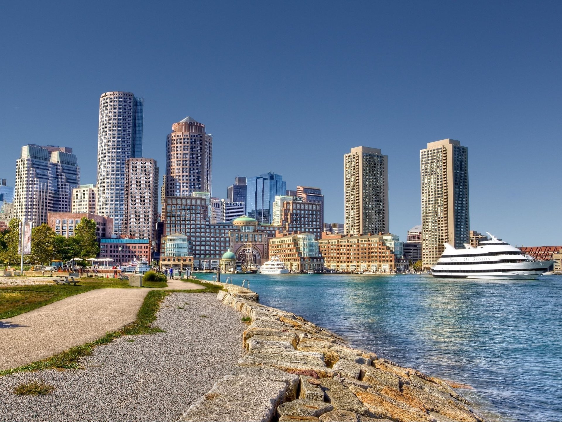 boston embankment architecture boston city metropolis boat skyscrapers houses river stones alley view blue sky citie