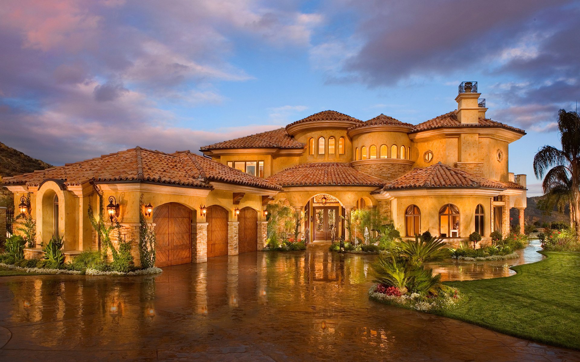 casa palazzo design sera lanterne acqua cielo nuvole luce nelle finestre verde vegetazione edifici