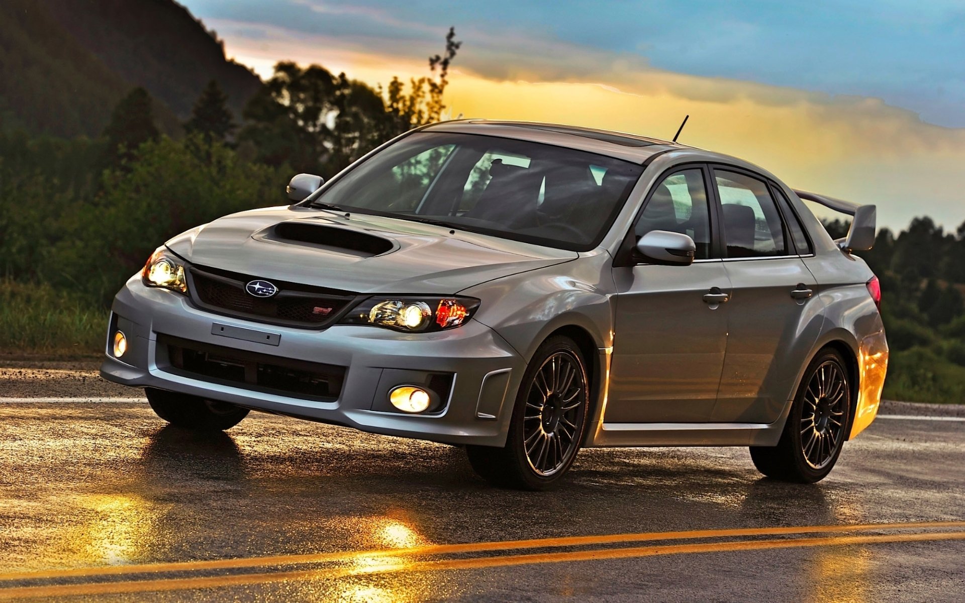 ubaru impreza wrx sti subaru impreza sedán frente carretera resplandor cielo