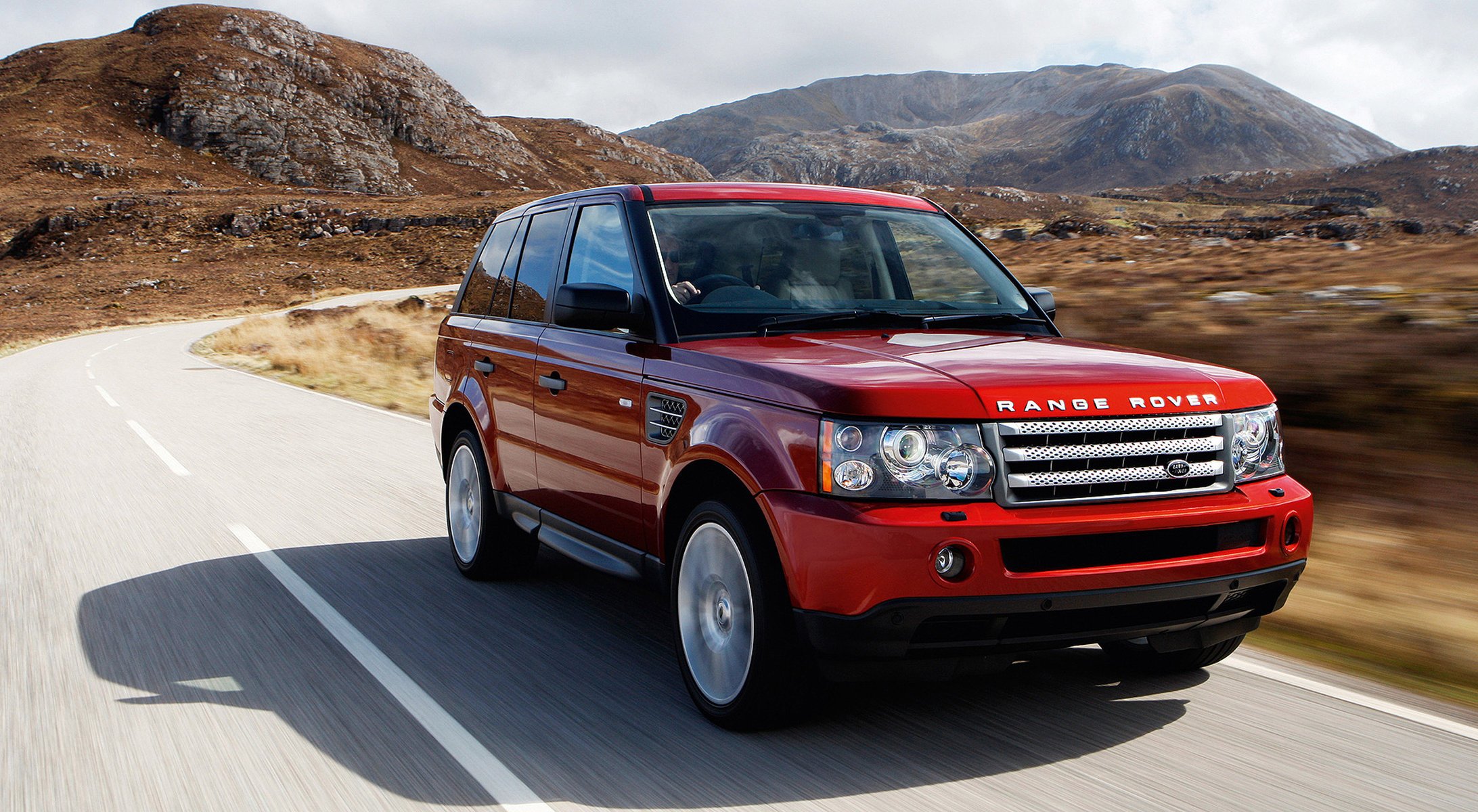 red mountains land rover machine auto red car the highlands markup road turn speed movement cars transport vehicle