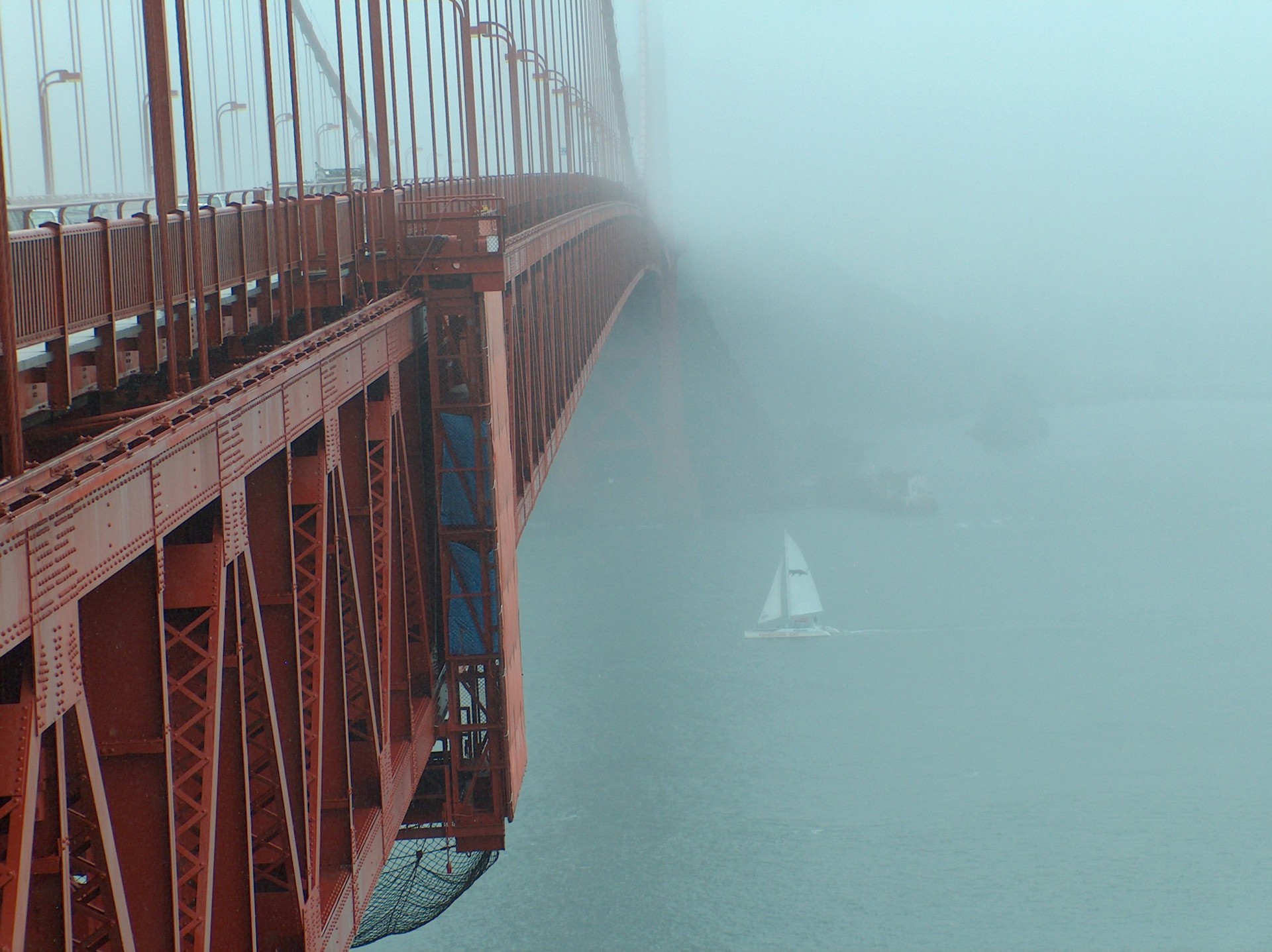 bridge fog sailboats red